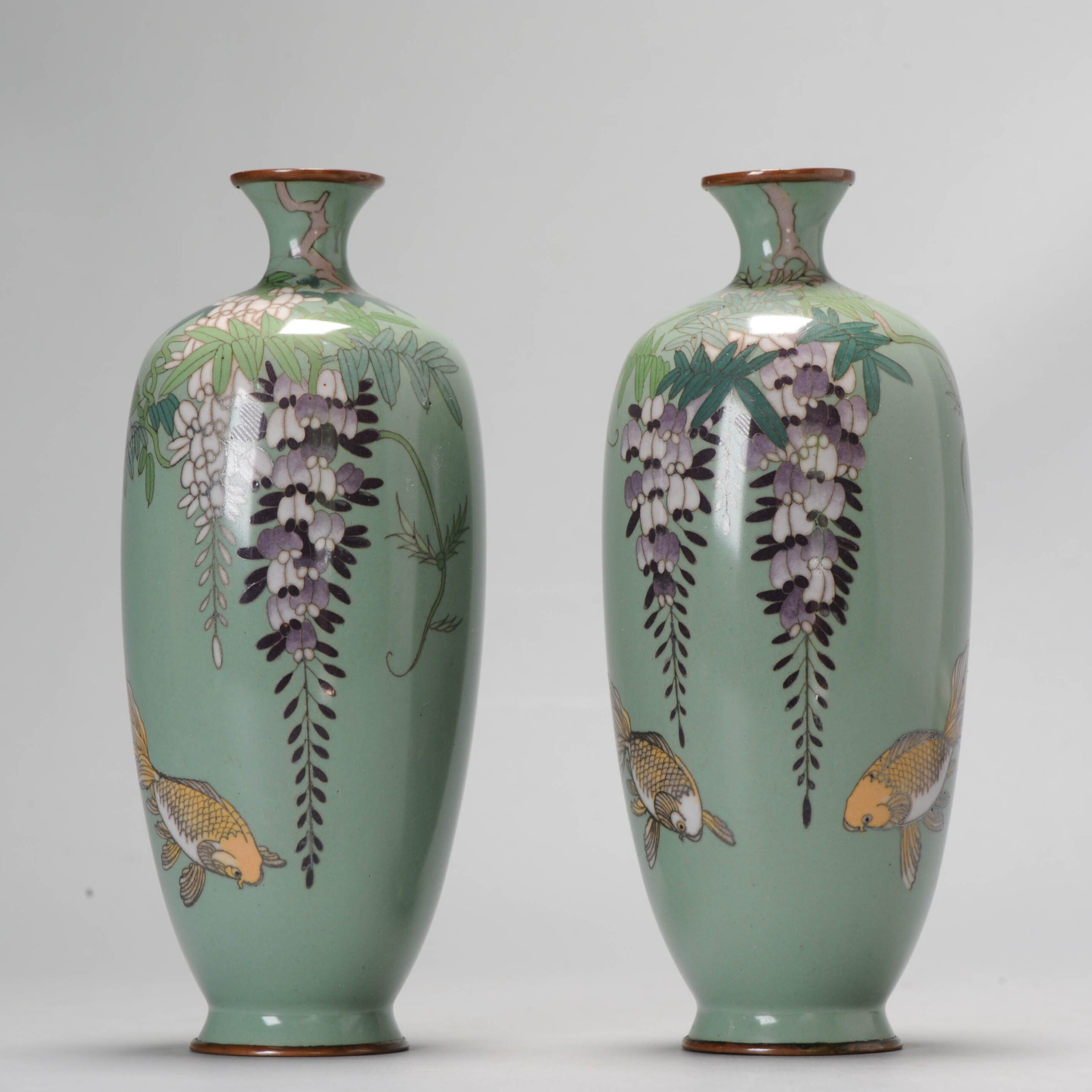 A Pair of Vases with Wisteria flowers and Goldfish on green cloisonné enamel Meiji era (1868-1912)